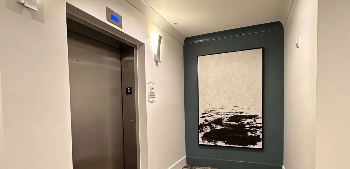 Elevator lobby wall covering, after renovation