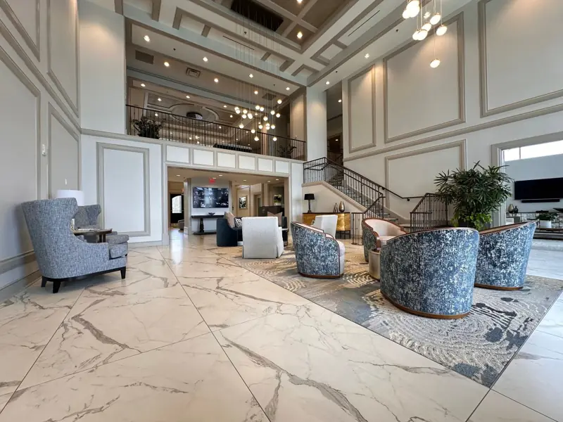 Two-story atrium lobby with large-format porcelain floor