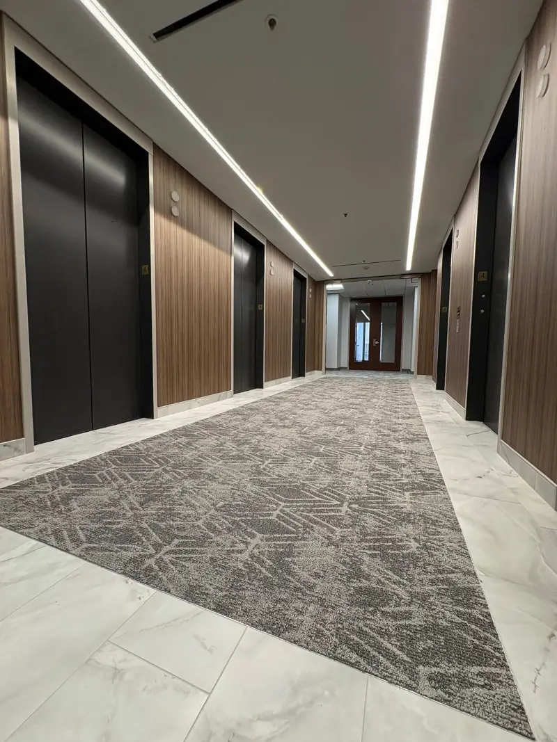 Elevator corridor with new patterned carpet