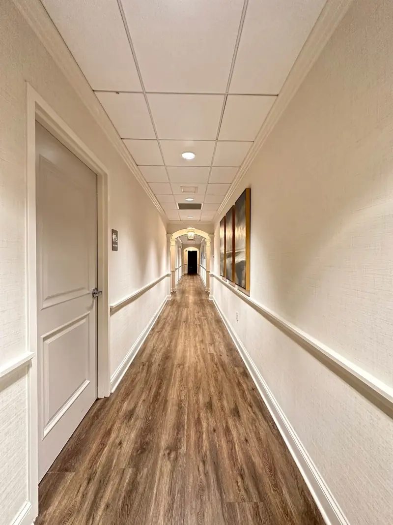 Corridor with grasscloth wall covering