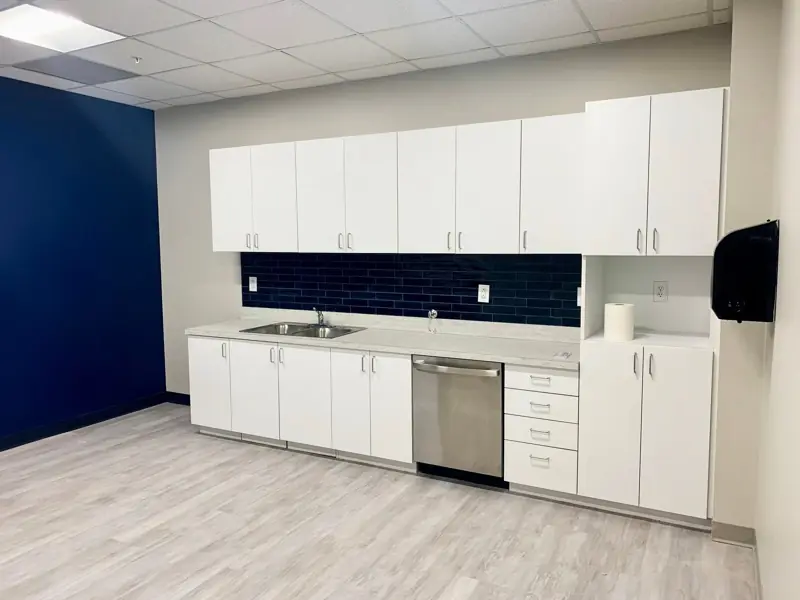 Kitchenette with navy accent wall