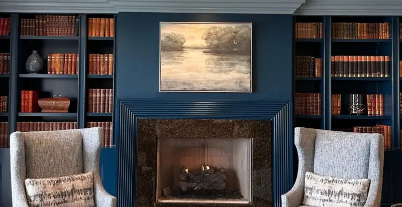 Library lounge with navy painted built-ins