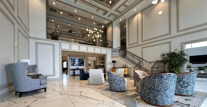 Lobby seating area with new porcelain floor and rug