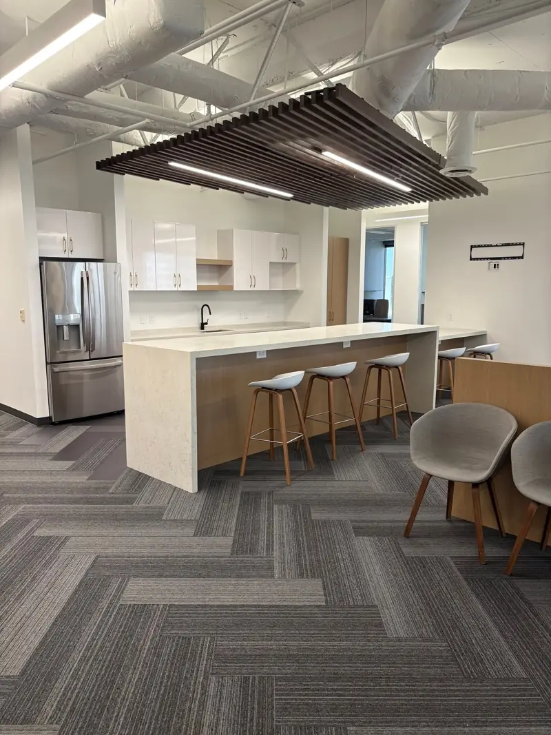 Office kitchen and lounge with wood slat ceiling