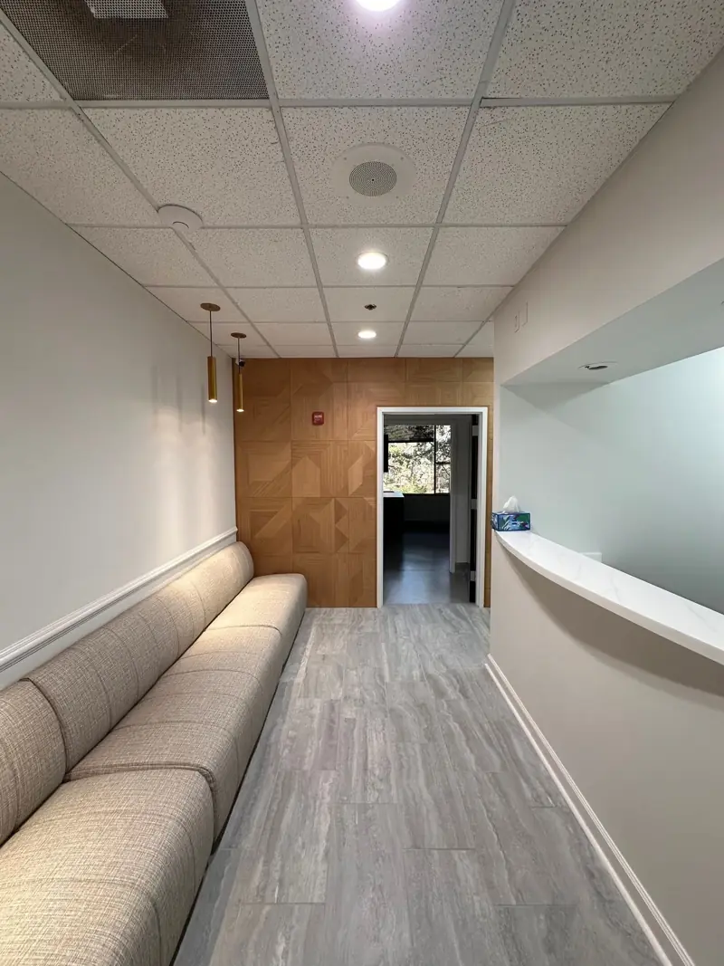 Medical waiting area with wood wall panels and new tile