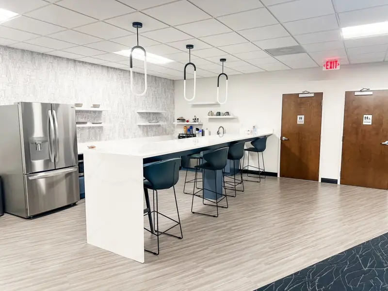 Office kitchen with patterned wall covering